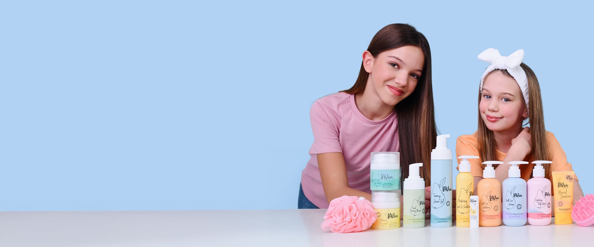 Two girls with wide range of Lav Kids products