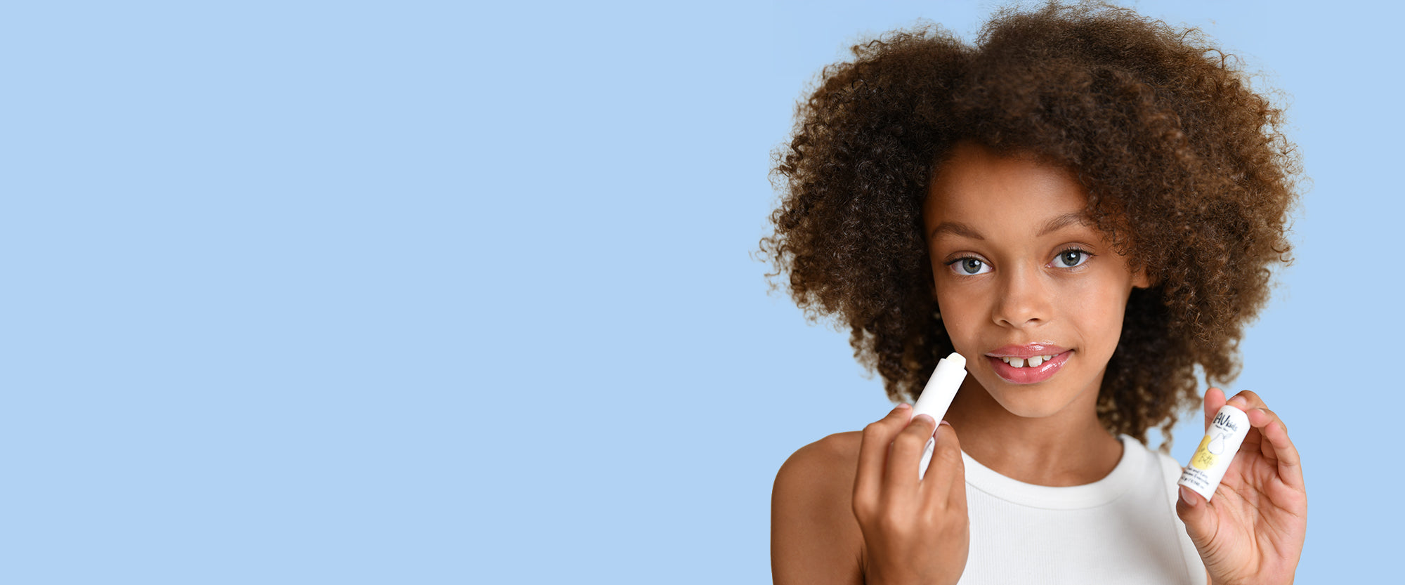 Girl showing lip balm by Lav Kids