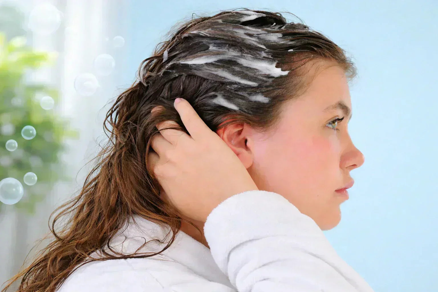 Best shampoo for kids – young girl washing hair with gentle and safe shampoo for soft and healthy hair